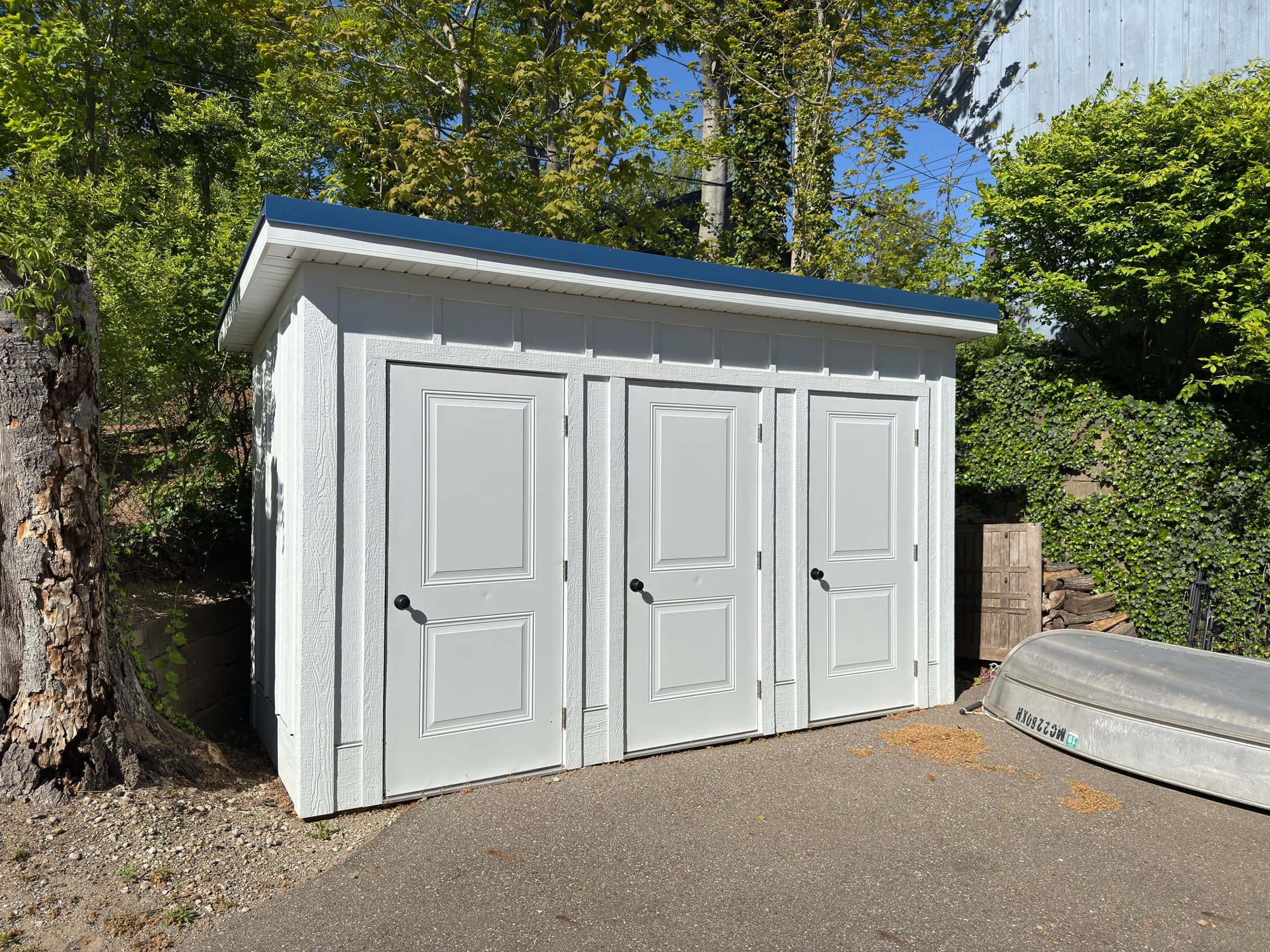 Custom painted three-door outbuilding with modern trim, Southwest Michigan