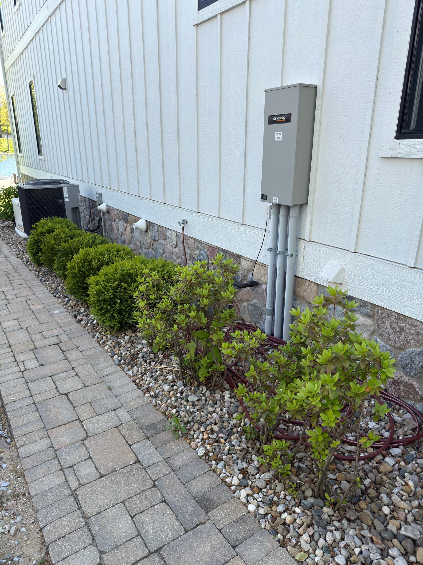 Downspout drainage system with paver walkway and gravel bed, Southwest Michigan